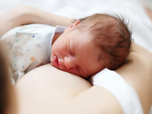 51646868 - one day old newborn baby with his mother